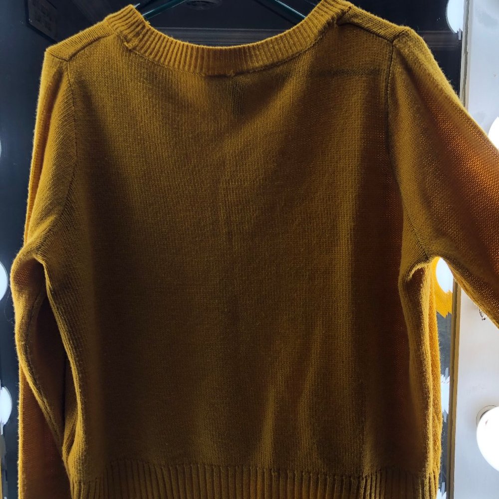 yellow sweater